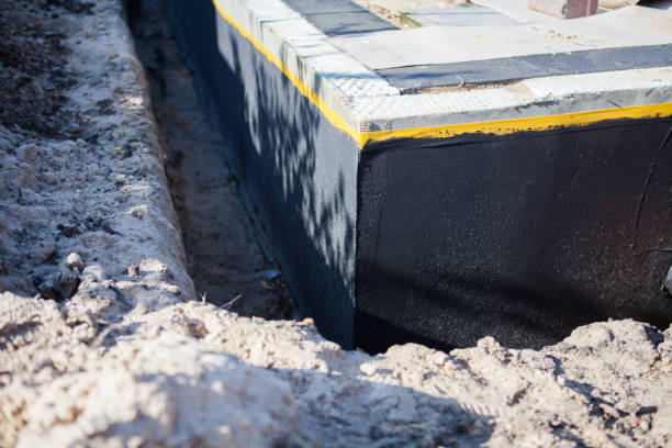 Professional Basement Waterproofing technician working in Central Islip, NY